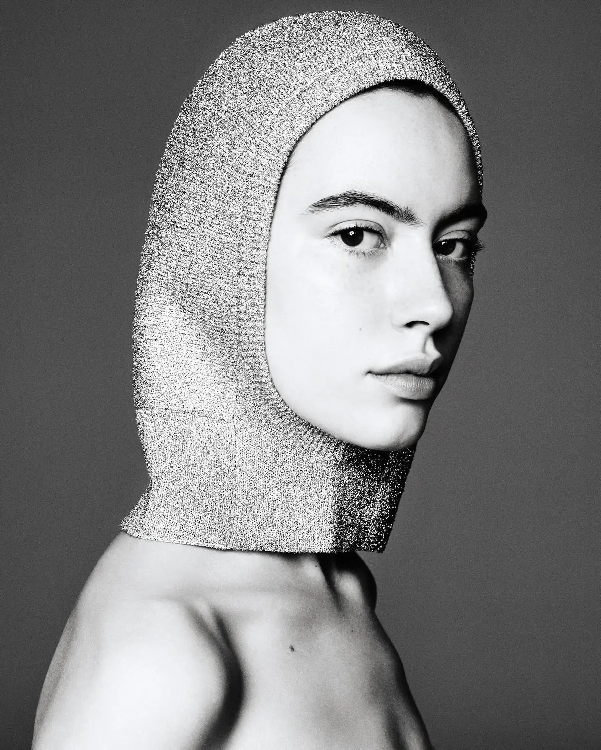 Aoife Simone in a silver knit hood, photographed by Christopher Morel